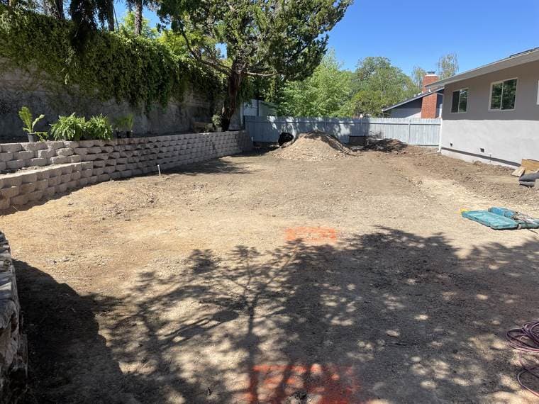 Engineered block retaining wall on a graded slope